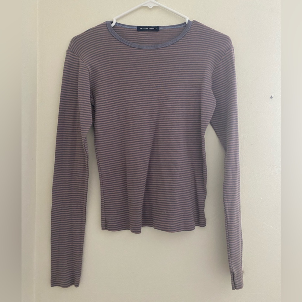 This is a brandy melville long sleeve pink and purple striped shirt! 🩷💜